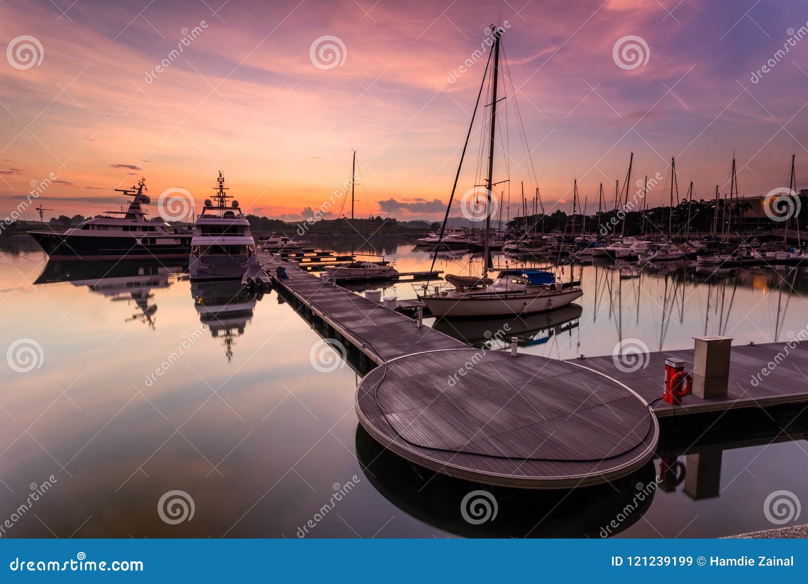 A Majestic Sunrise With Boat Resting Near The Dock As ...