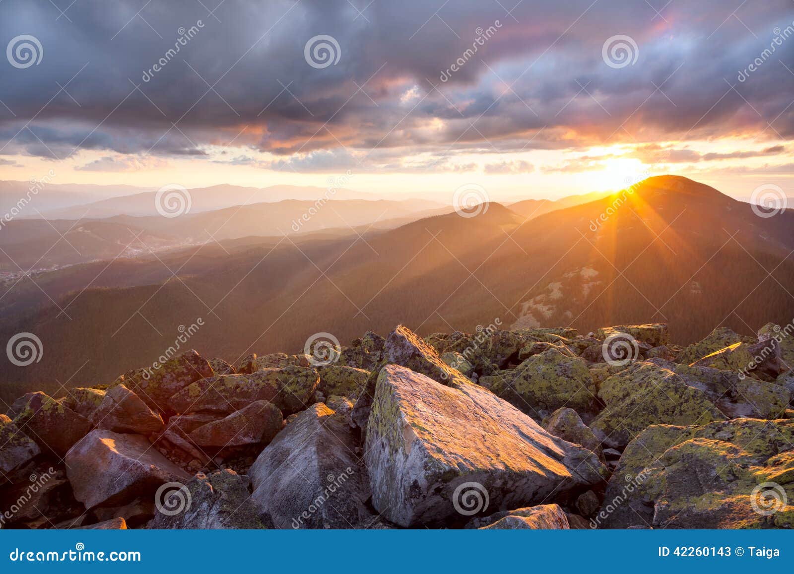 majestic sunset in the mountains landscape. dramatic sky and col