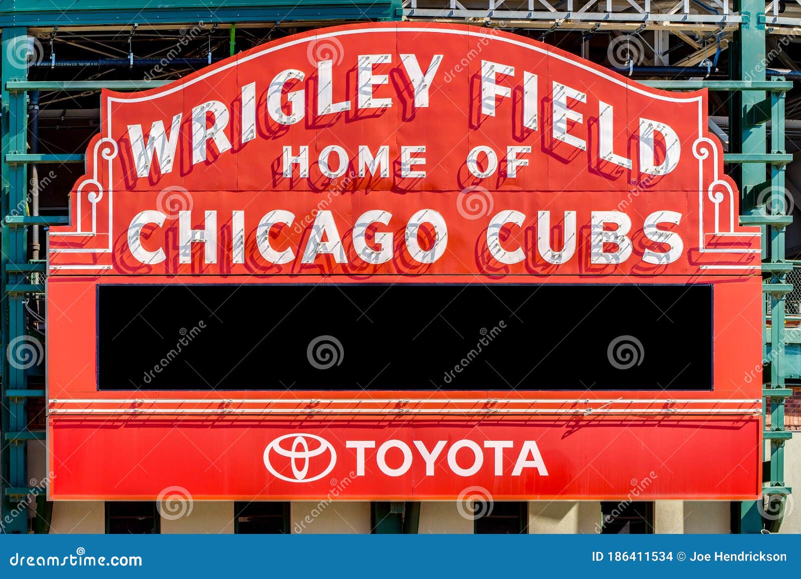 wrigley-field-entrance-sign-at-night - Baseball Brew Crew