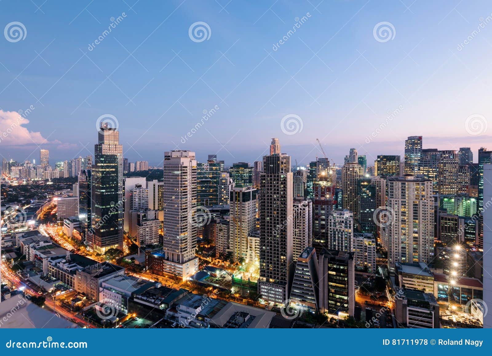 Philippines, Luzon, Manila. Makati business district with Louis