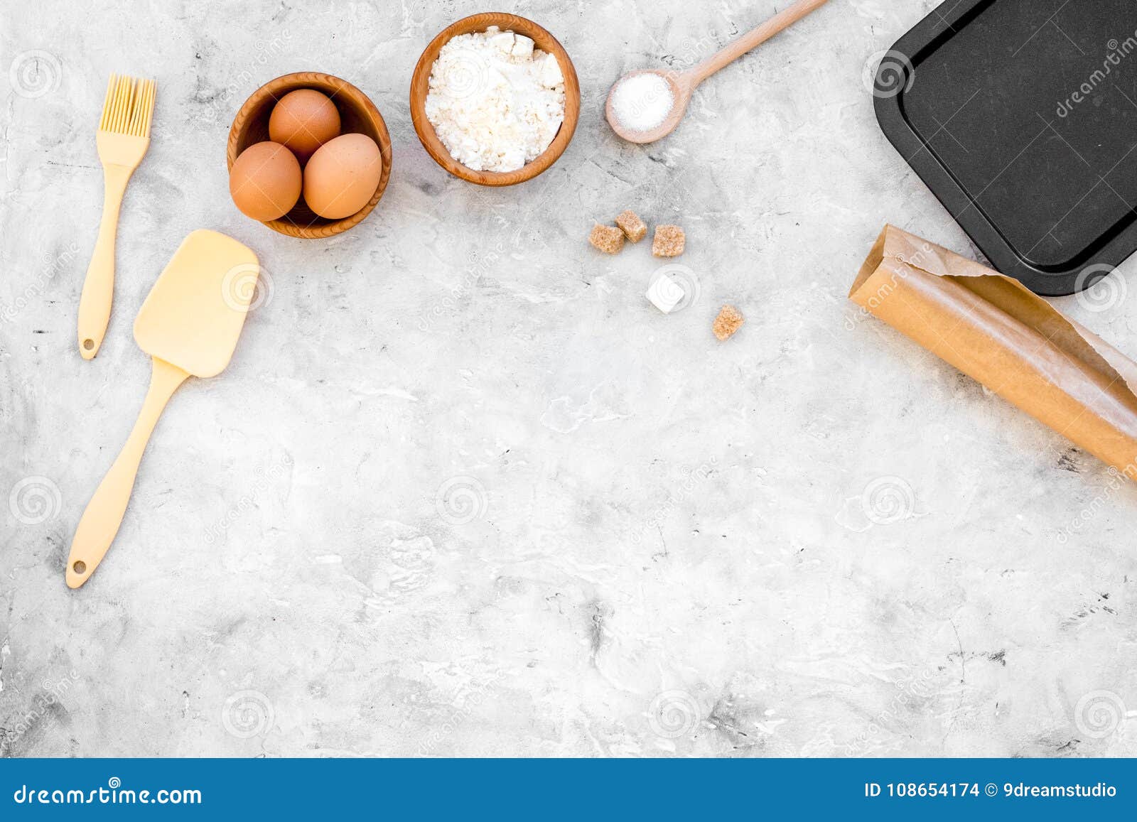 make dough. ingedients flour, eggs near cookware on grey background top view copy space