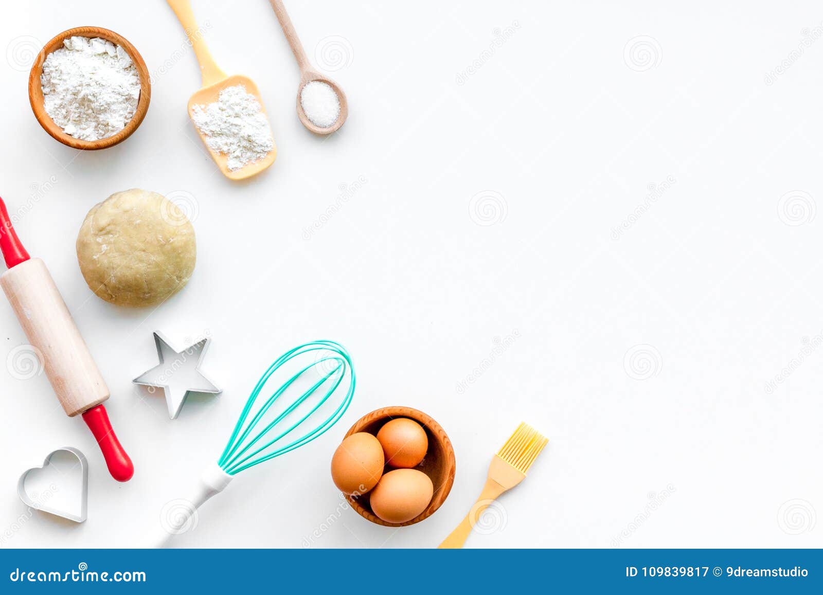make dough. ingedients flour, eggs near cookware on white background top view copy space