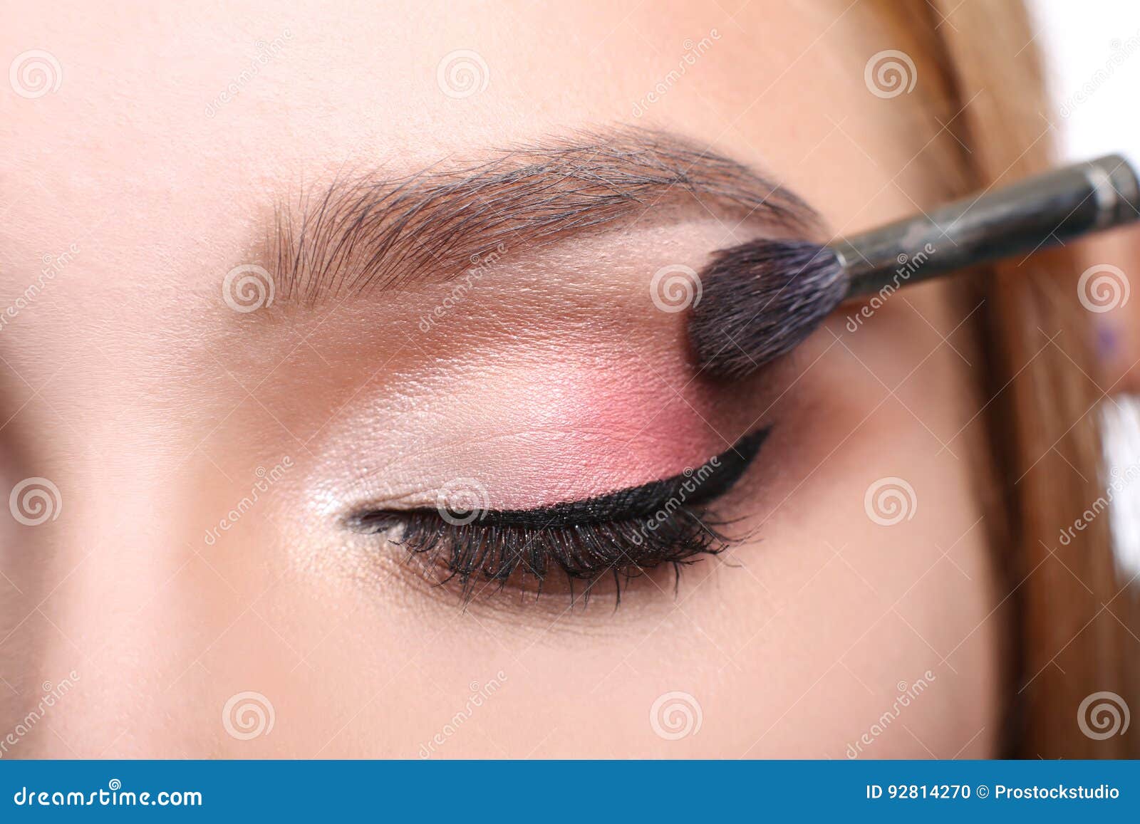 make-up artist apply eyeshadow with brush, beauty
