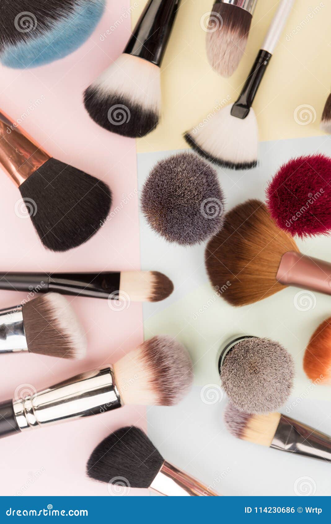 Makeup brushes on colored stock photo. Image of fashion 114230686