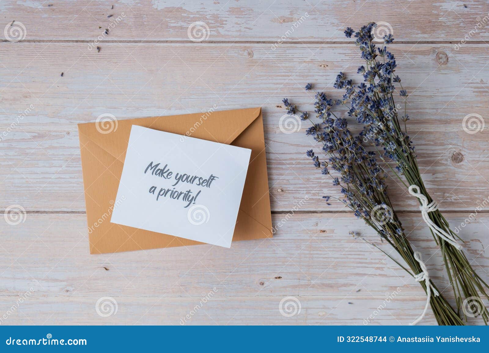 make yourself a priority text on supportive message paper note reminder from beige envelope. flat lay composition dry