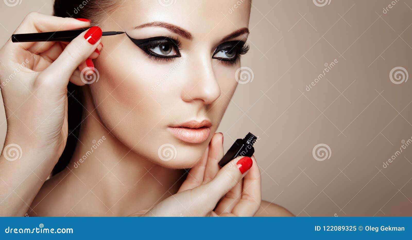 makeup artist applies eyeshadow