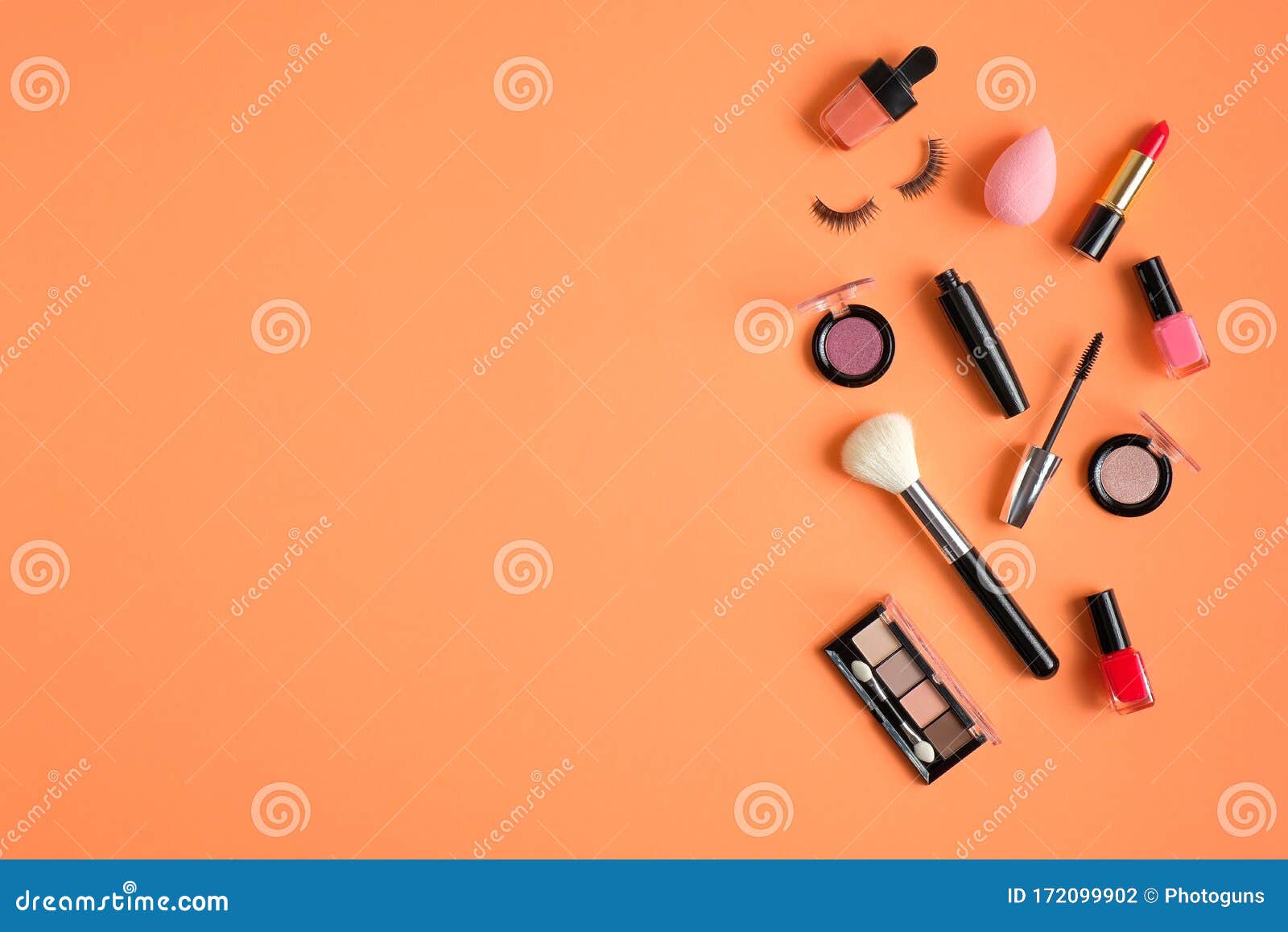 Makeup Cosmetics and Beauty Products Spilling Out on Pastel Peach