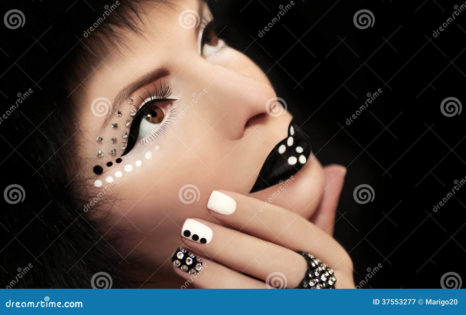 makeup and manicure with rhinestones.