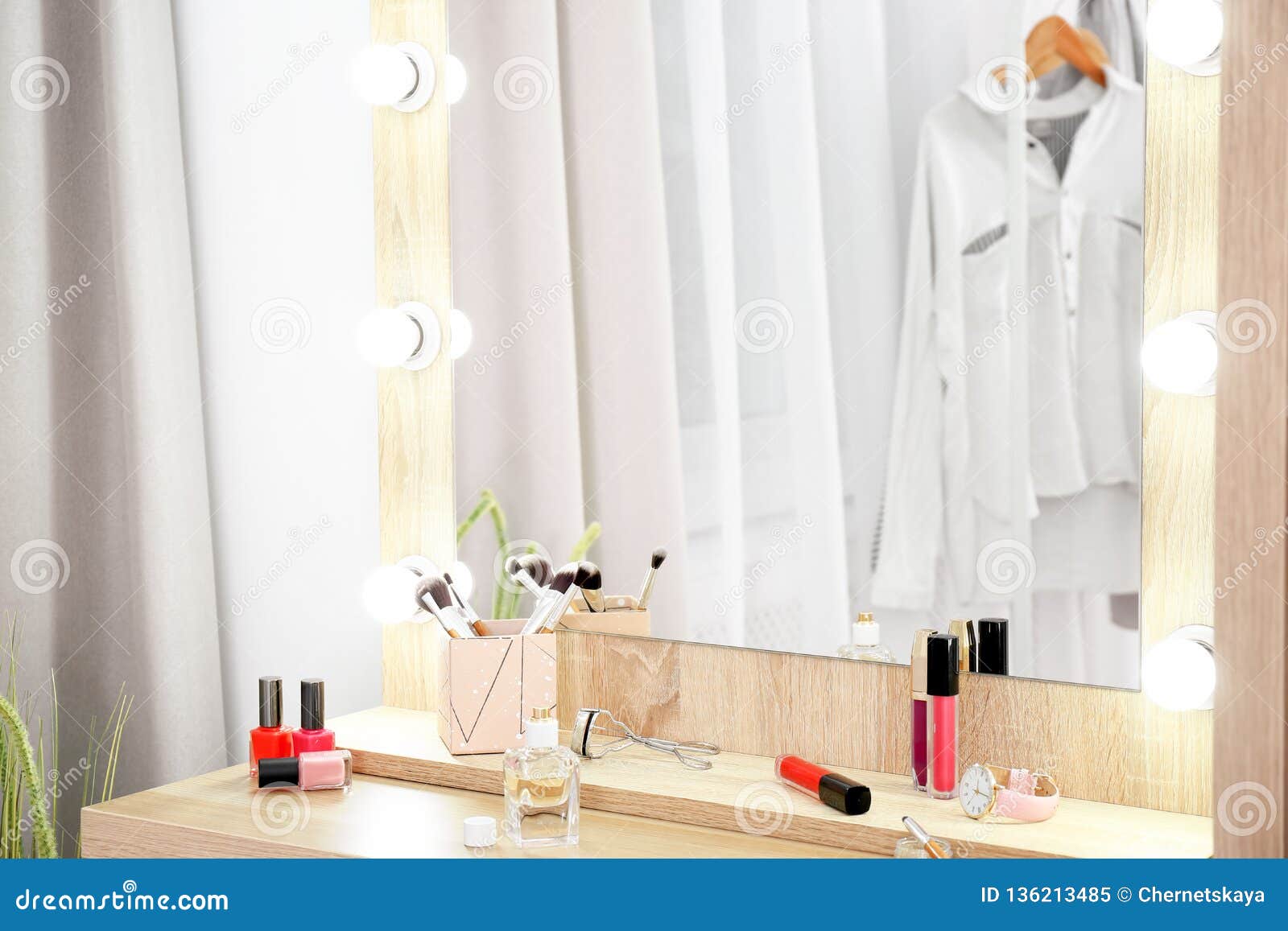 Makeup Mirror on Table Near White Wall in Dressing Room Stock Image