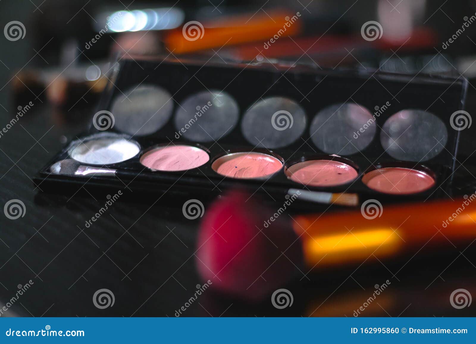 A Makeup Palette with Brushes in Background / Contouring Stock Photo