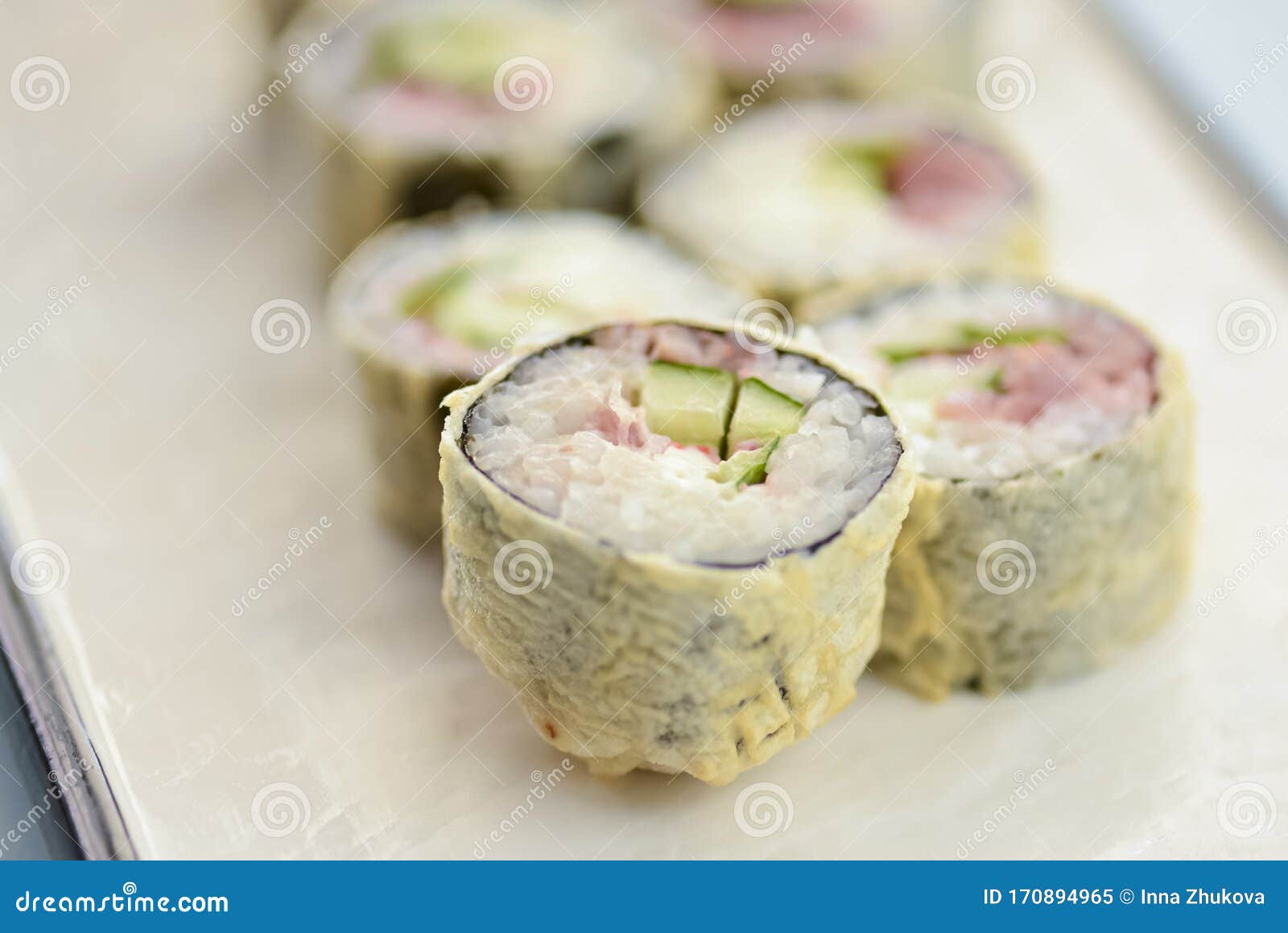 Maki Sushi California Fried Hot Rolls with Fresh Salmon, Cucumber and Cream  Cheese Philadelphia Inside on White Plate Stock Image - Image of roll,  rice: 170894965