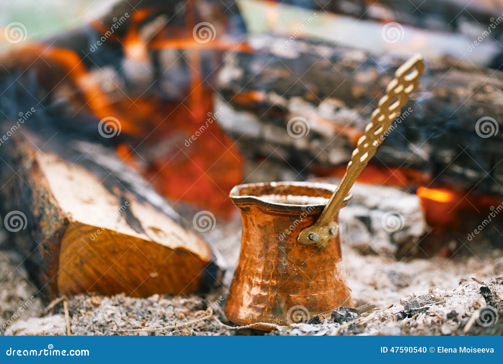 Making Coffee in the Fireplace when Camping or Hiking Stock Photo