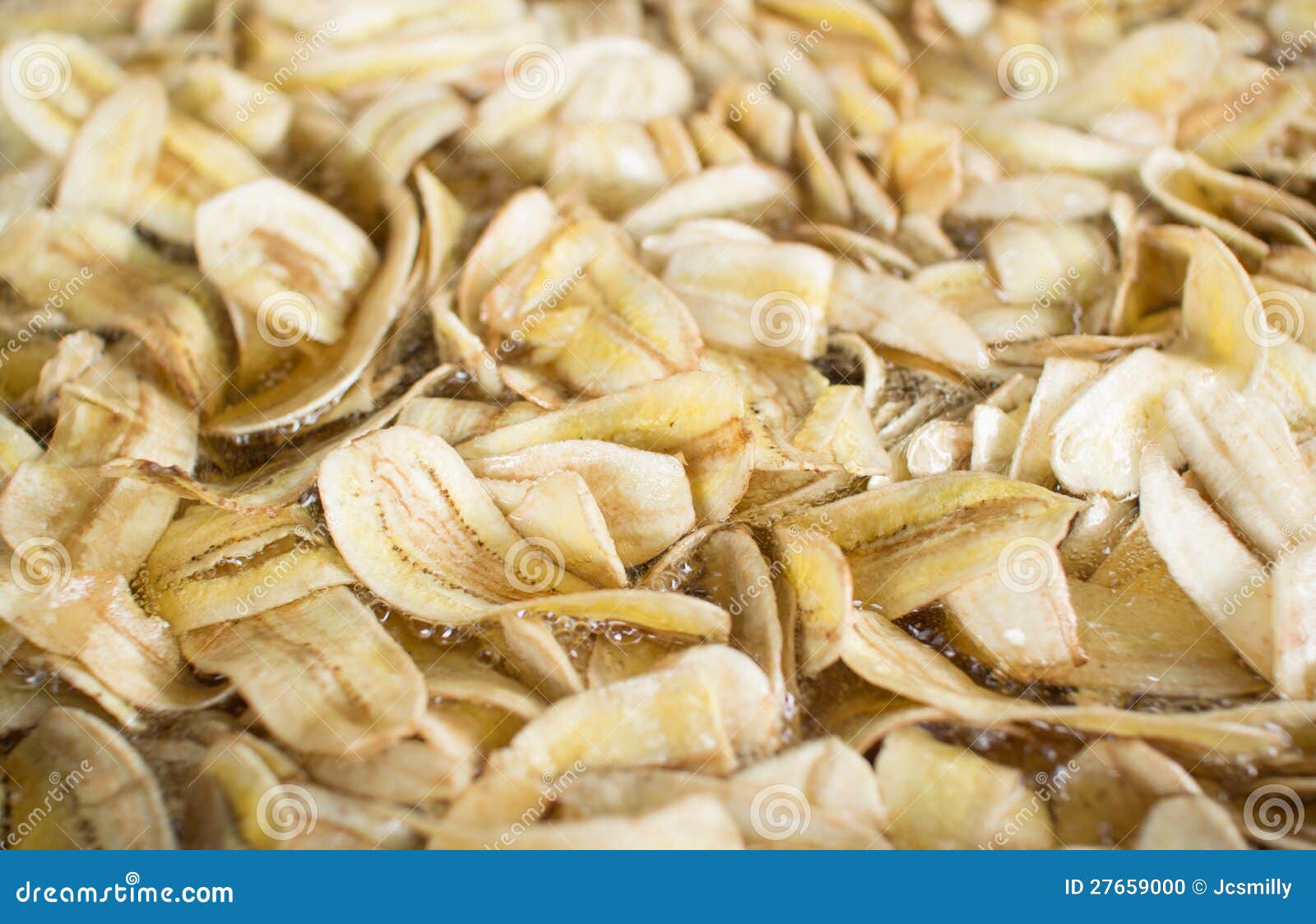 Making dried banana chips stock photo. Image of crispy 27659000