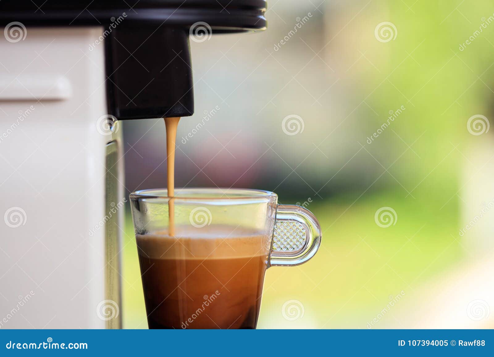 Espresso Coffee Machine On A Blur Green Background Space For Text