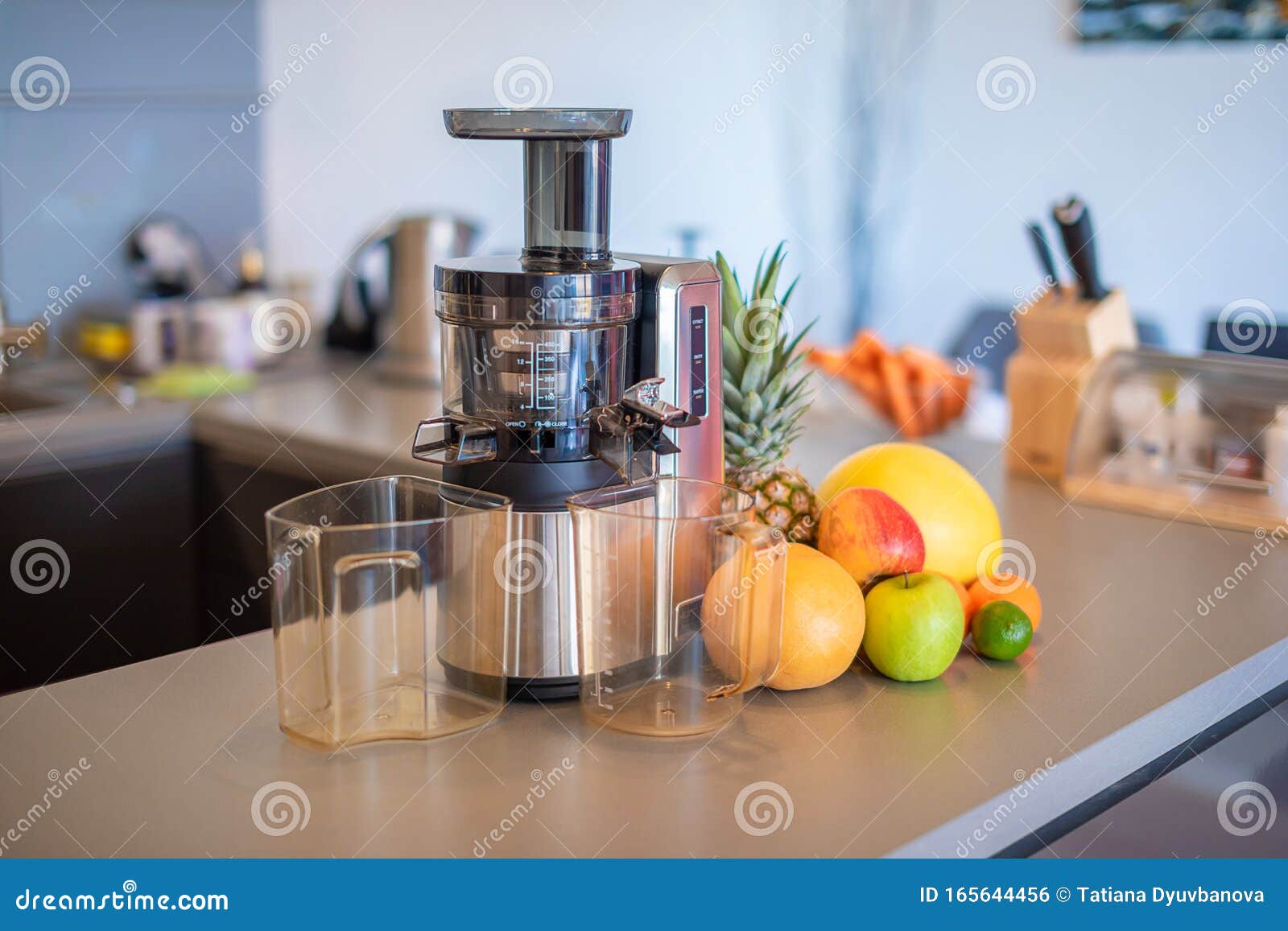 Making Fruit Juice with Juicer Machine in Home Kitchen, Healthy Eating