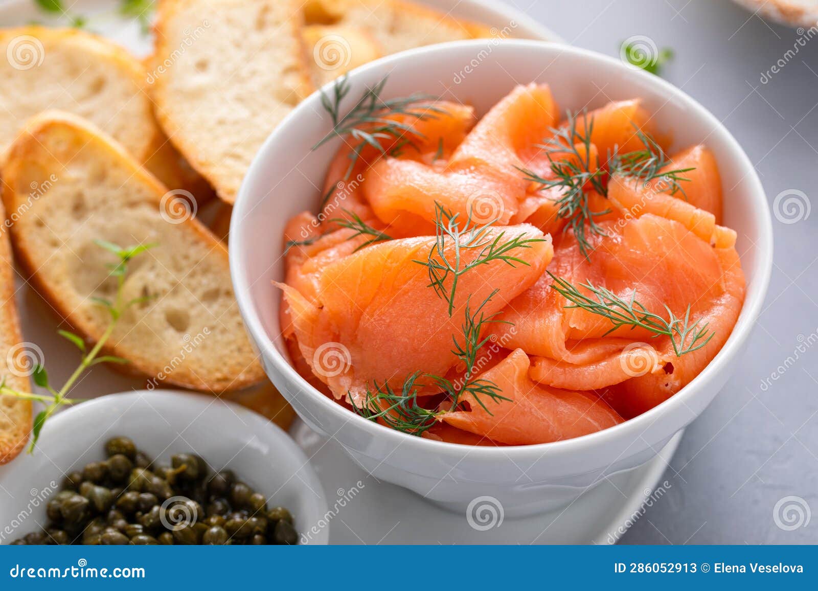 Making Salmon and Cream Cheese Bruschetta with Dill and Capers Stock
