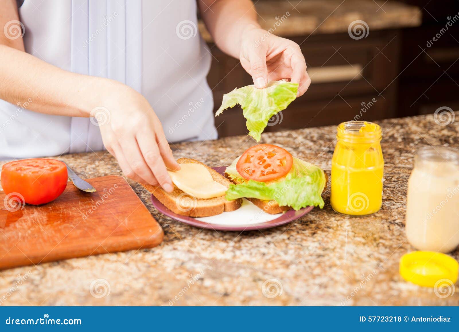 Making a sandwich at home stock photo. Image of indoor 57723218