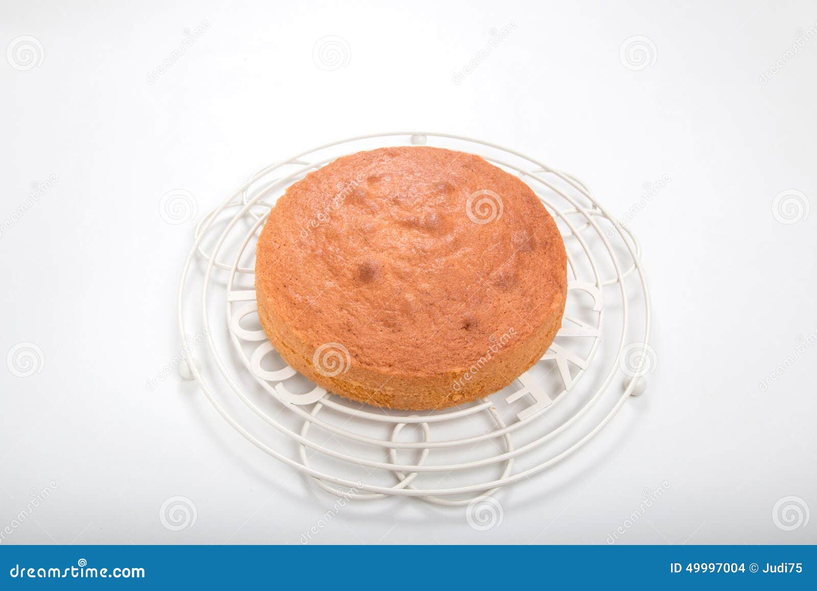 Making Sponge Cakes, Cooked Cake on Round Cooling Rack Stock Photo
