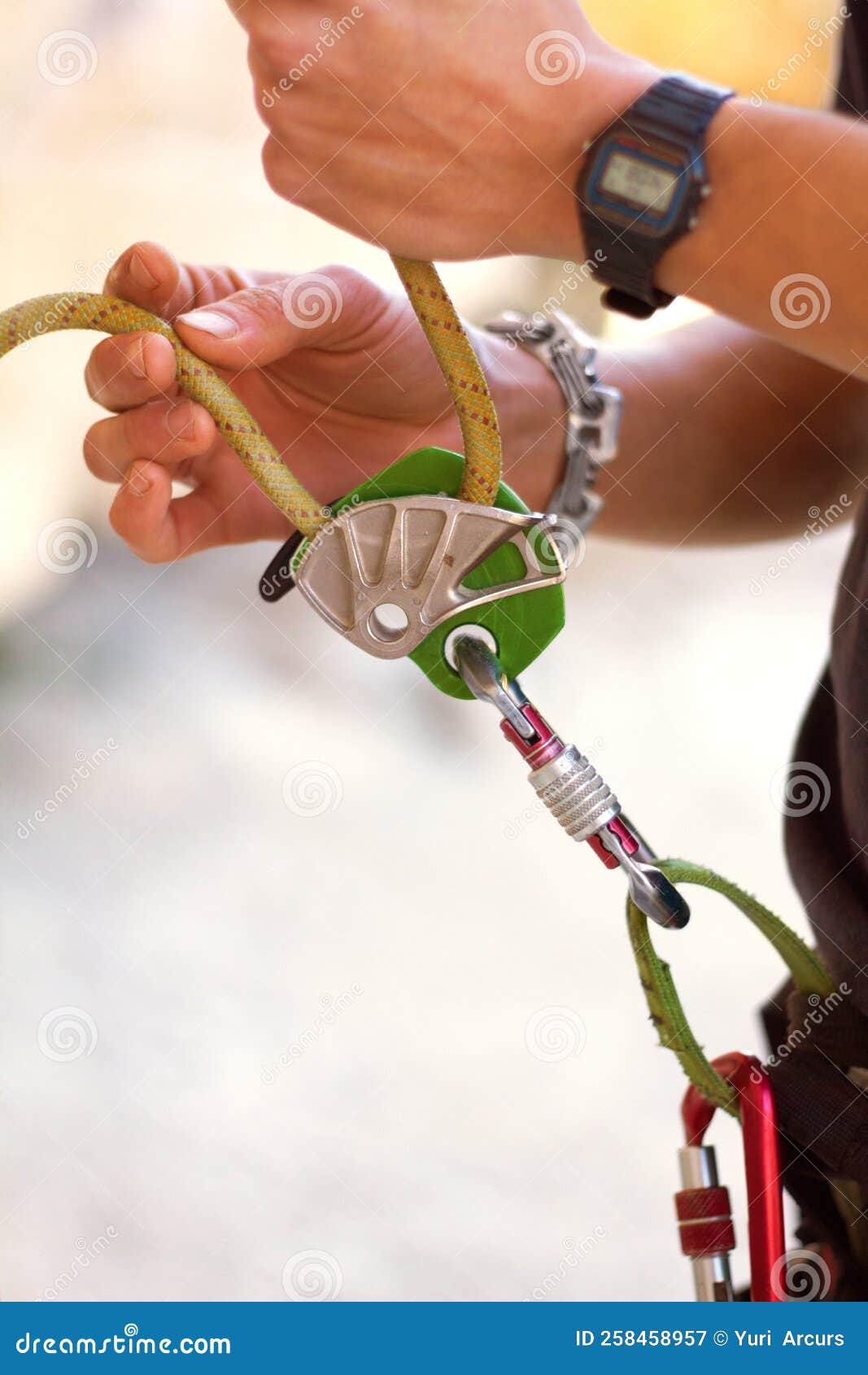 Making Sure Everything is in Place. a Young Rock Climber Standing and
