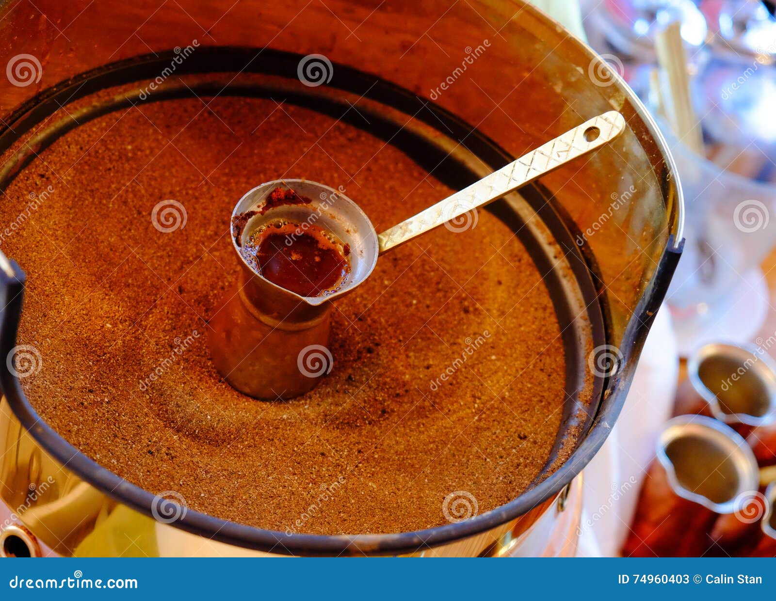 making of traditional greek turkish black coffee on sand