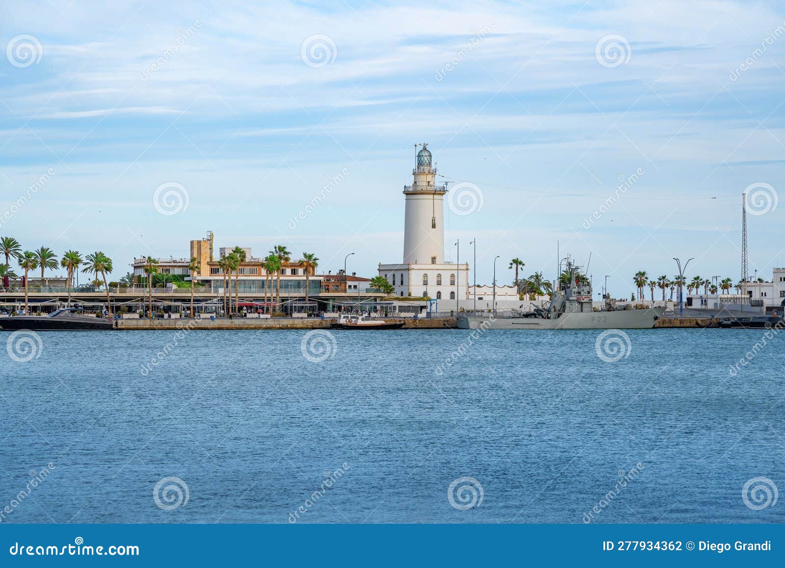 malaga lighthouse called la farola - malaga, andalusia, spain