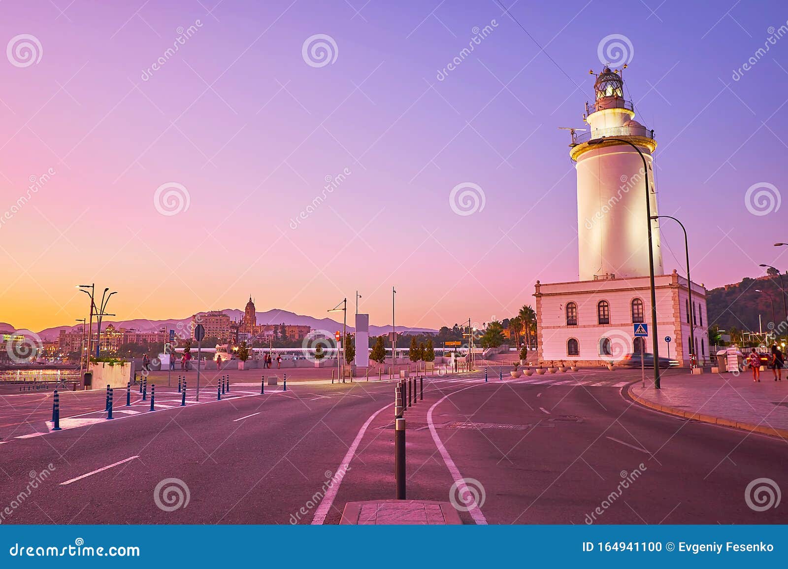 malaga lighthouse on twilight, spain