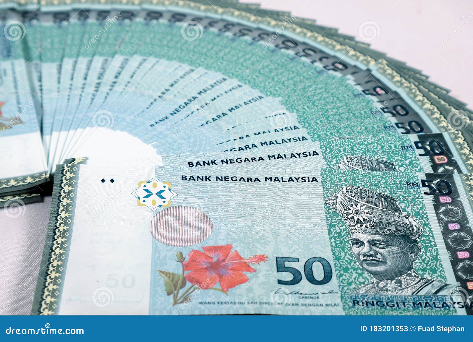 Stack Of Ringgit Malaysia Bank Note With Isolated White Background stack-of-ringgit-malaysia-bank-note-with-isolated-white-background