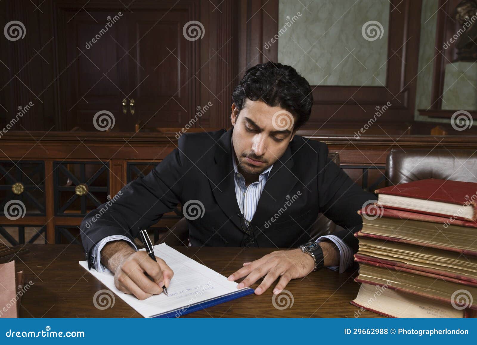 male advocate preparing notes