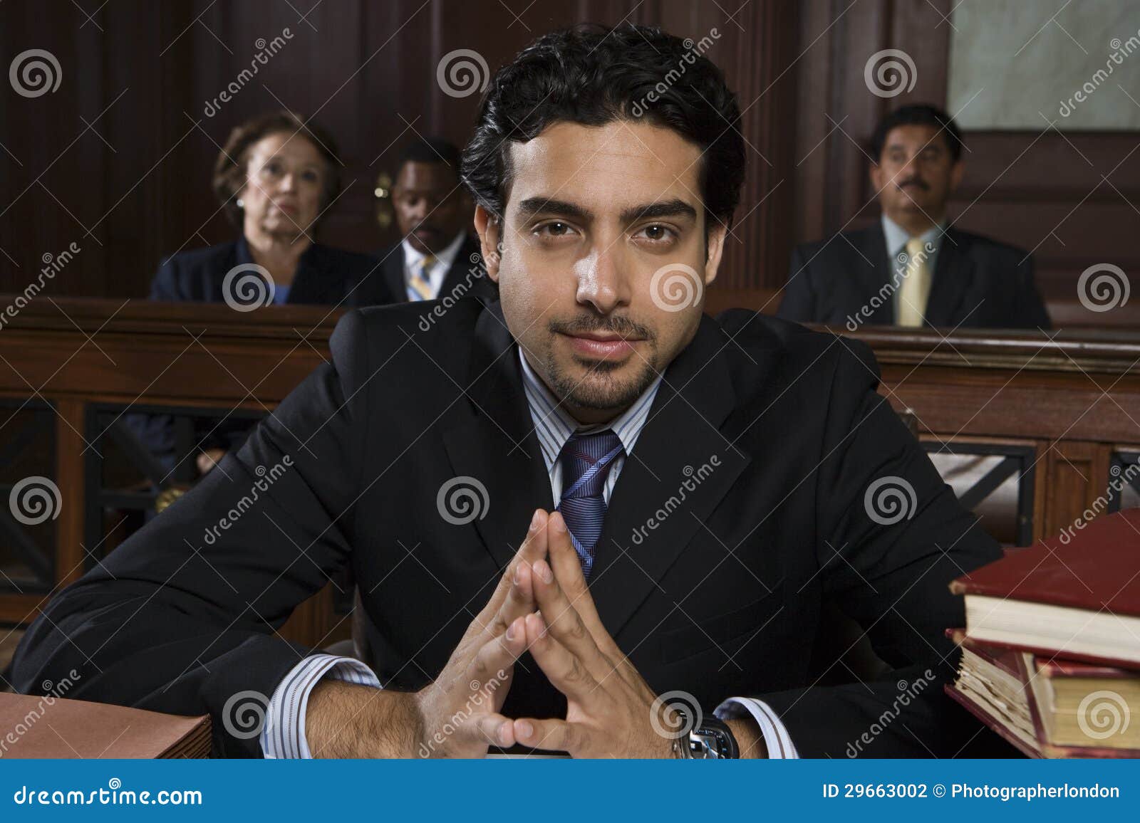 male advocate sitting in courtroom