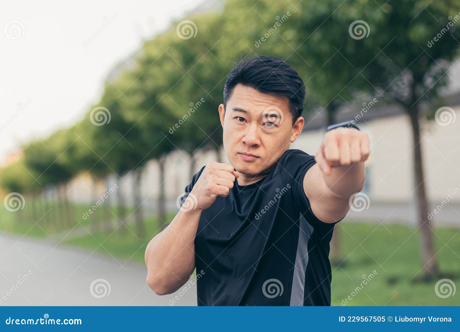 Male Asian Athlete Demonstrates Boxing Rack during Morning Jogging and ...
