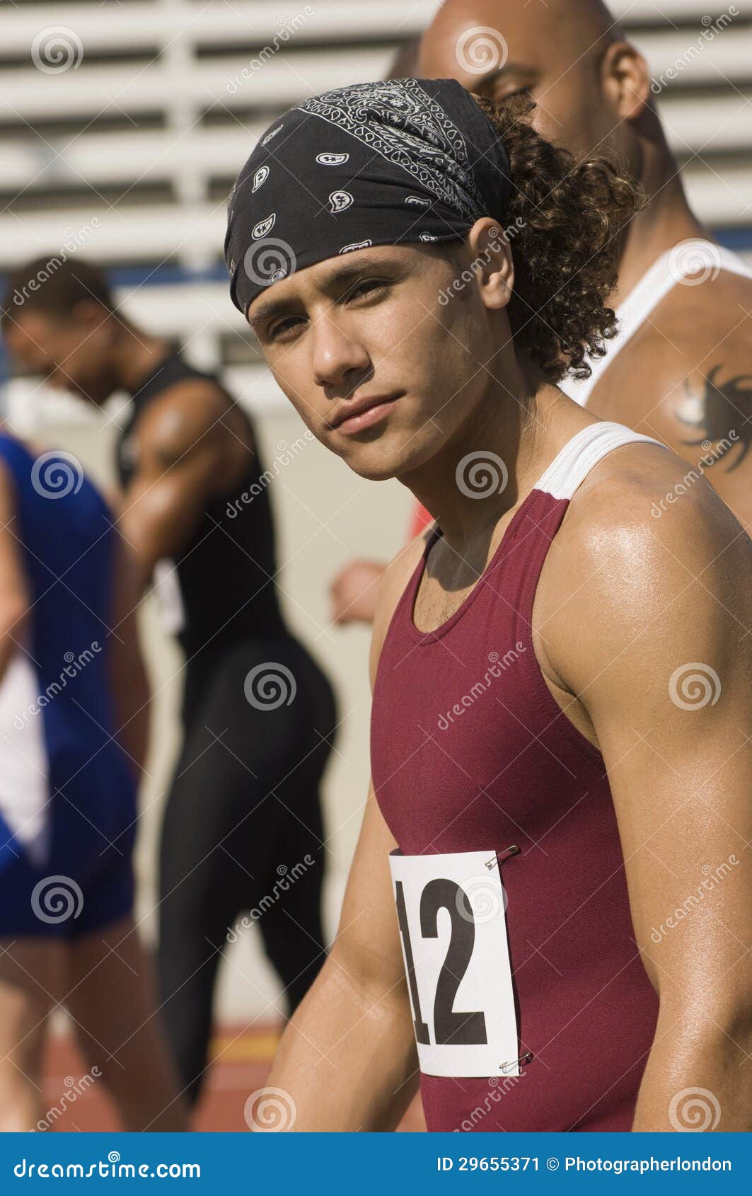 Male Athlete with Competitors in Stadium Stock Image Image of