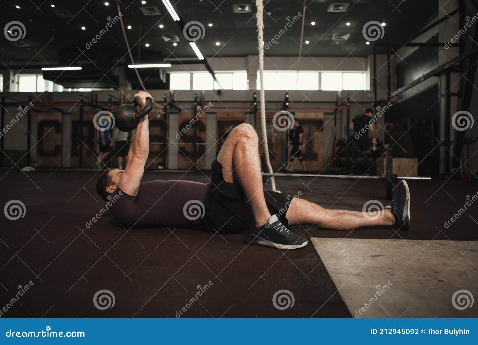 male cross fit athlete working out at the gym