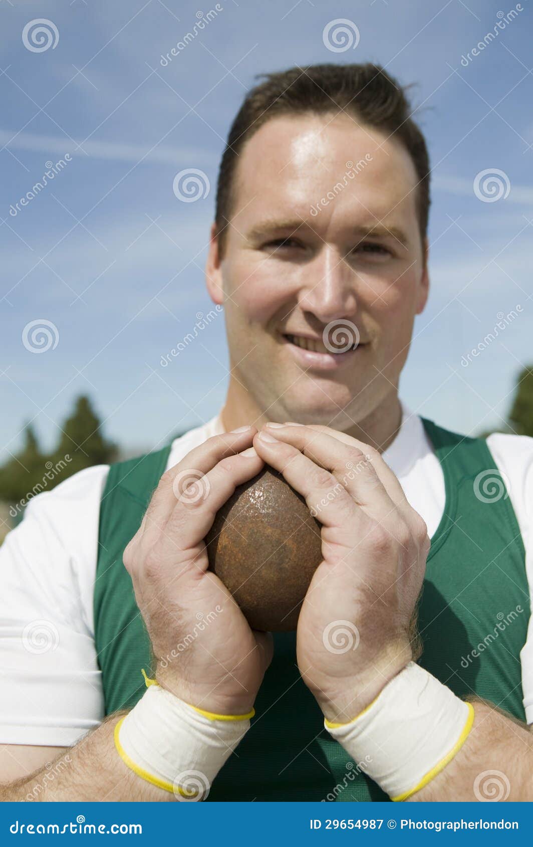 Male Athlete Holding Shot Put Stock Image Image of event, adult 29654987