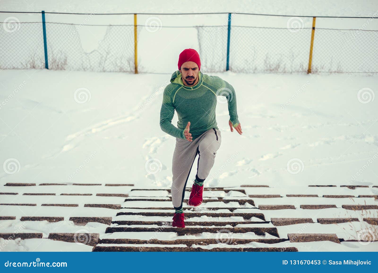 Athlete with Red Hat and Red Sneakers Running Up the Snowy Stairs Stock ...