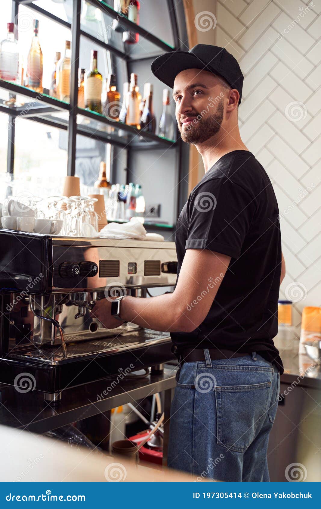 male barista working on coffee machine