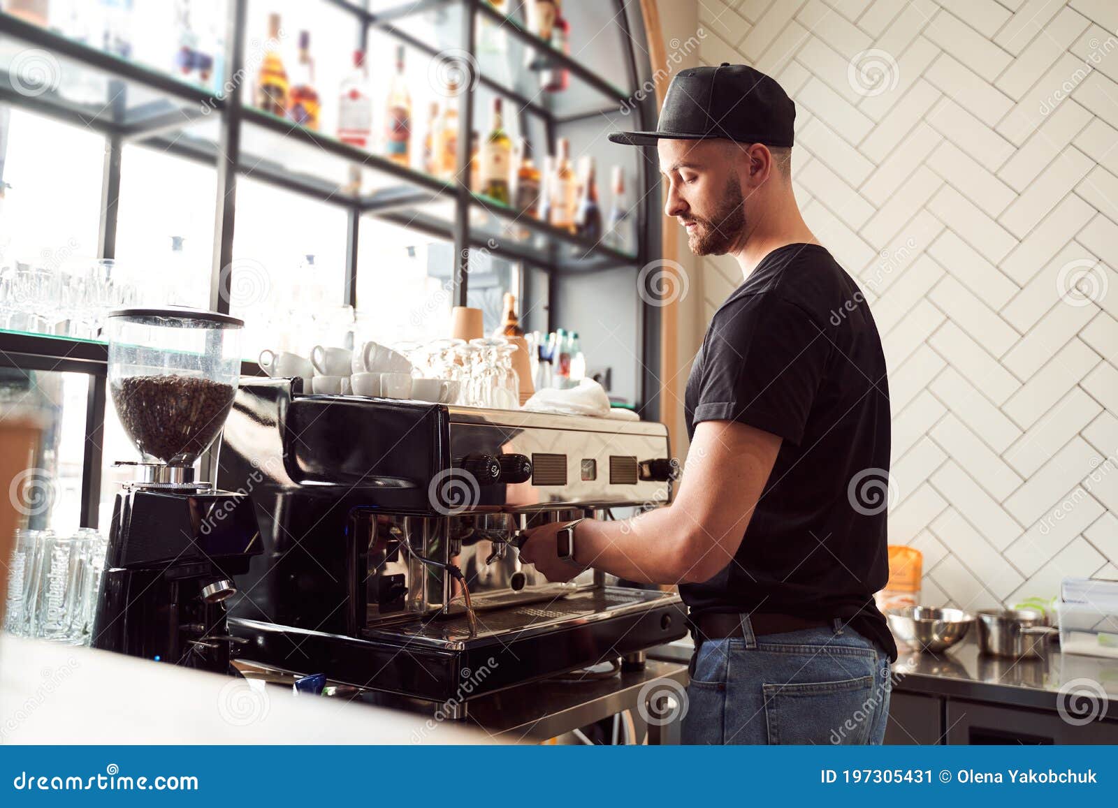 male barista working on coffee machine