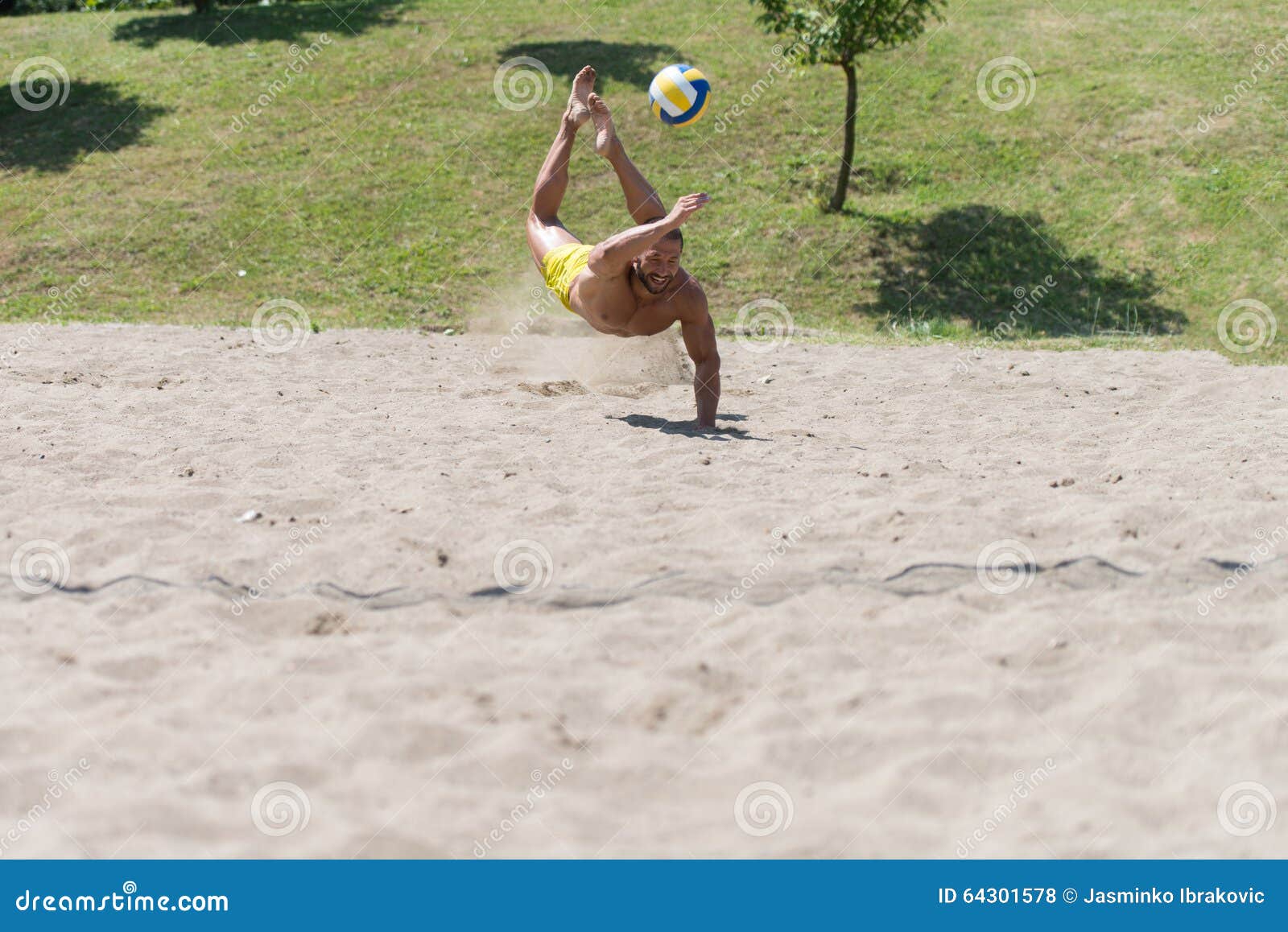 male beach volleyball game player jump on hot sand Stock Photo - Alamy