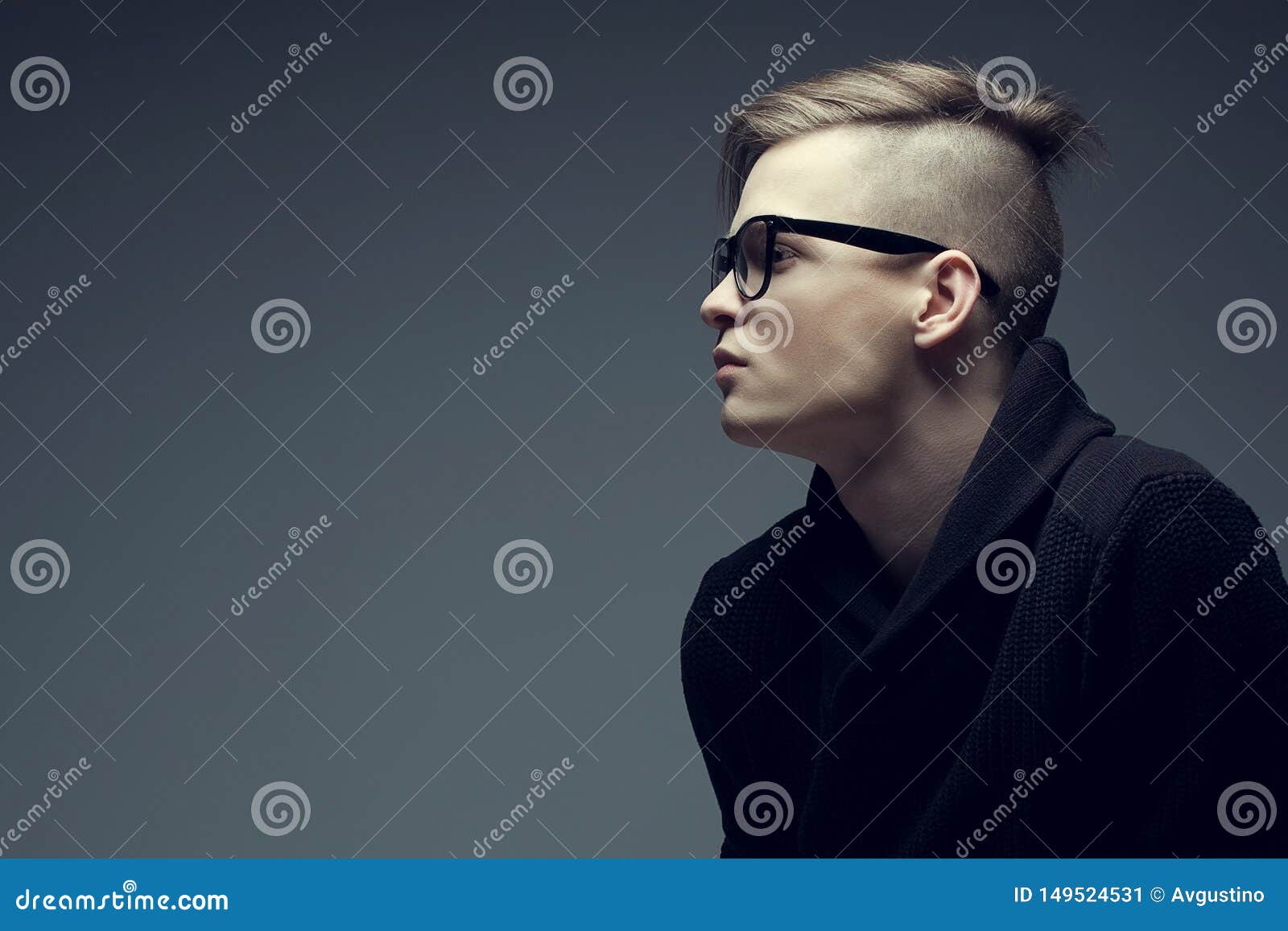 Male Beauty Concept. Portrait of a Fashionable Young Man with Stylish  Haircut Wearing Trendy Glasses and Sweater & Posing Over Stock Image -  Image of care, confident: 149524531