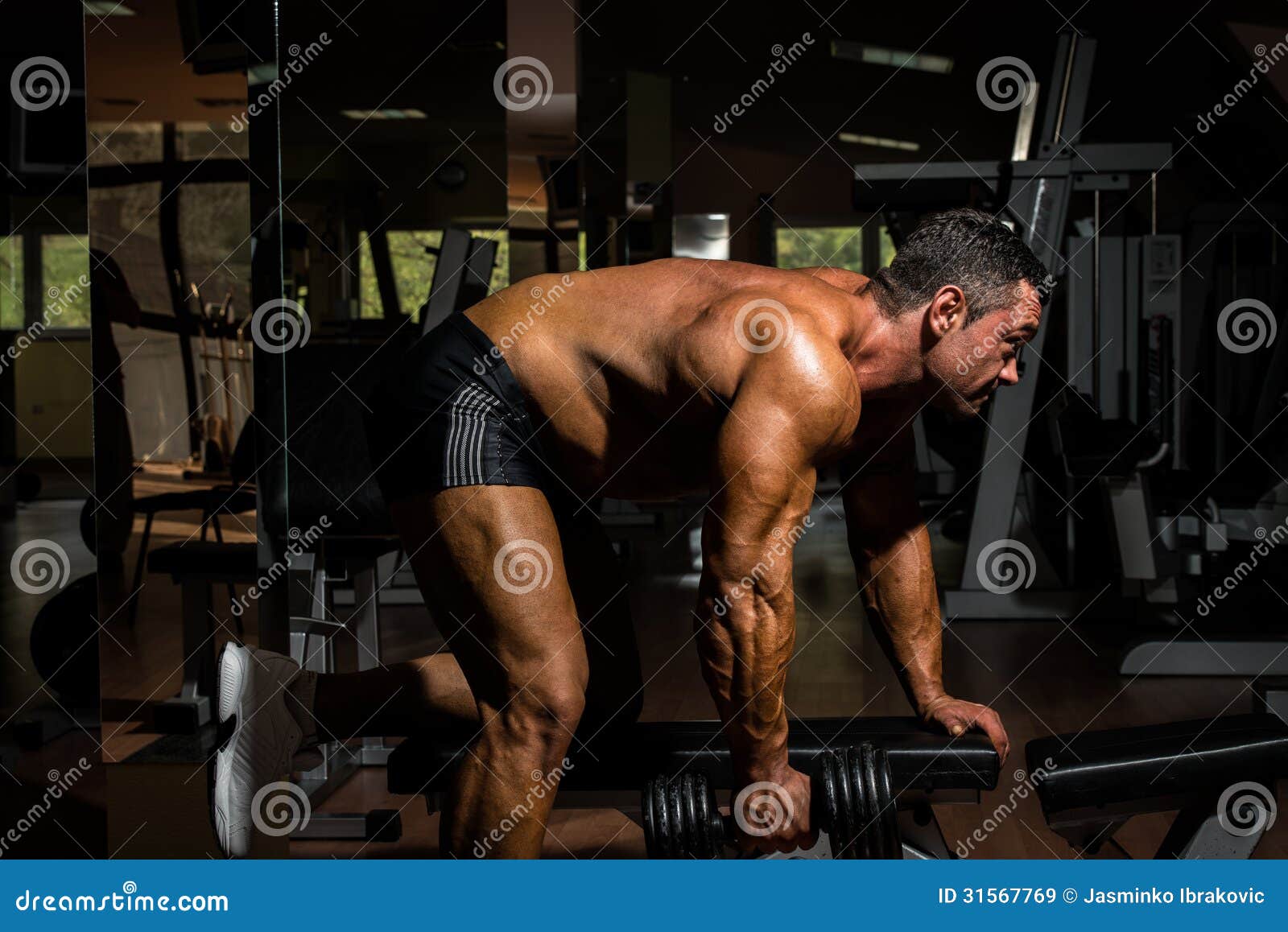 Male Bodybuilder Doing Heavy Weight Exercise for Back Stock Image
