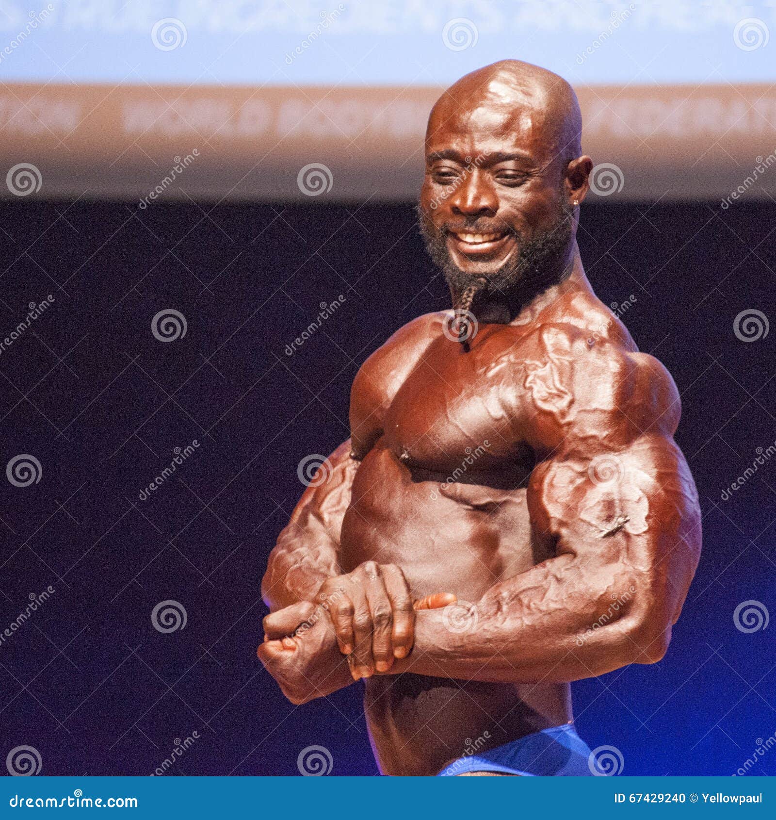 Bodybuilder side chest pose Stock Photo | Adobe Stock