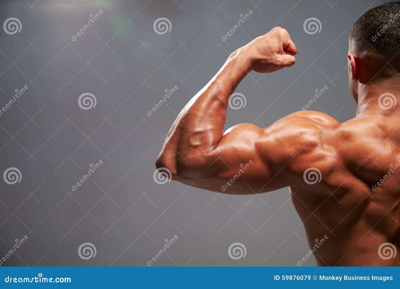 Bodybuilder Flexing Biceps Stock Photo 36992496