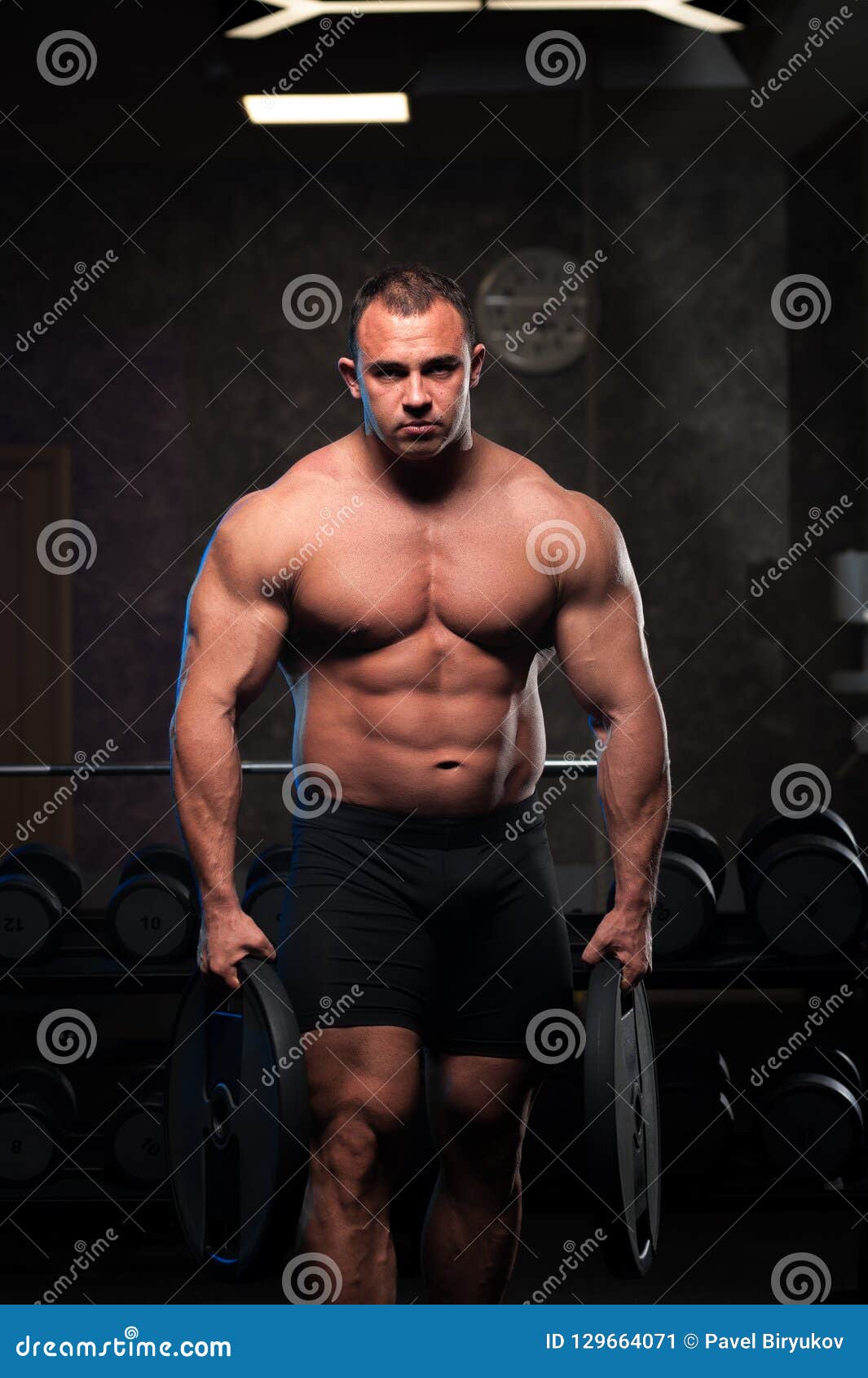 Male Bodybuilder With Naked Torso Posing In Gym Stock 