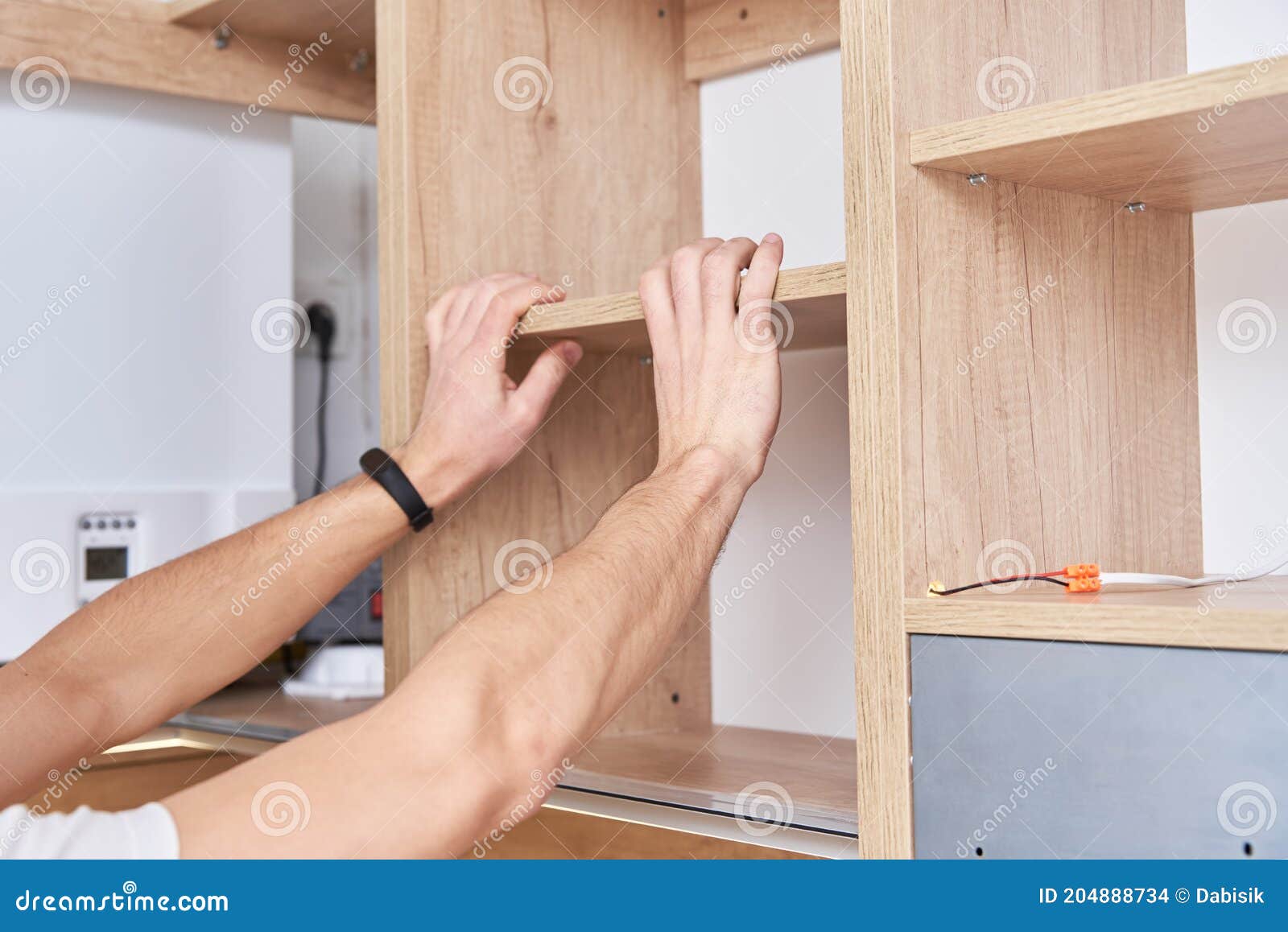 Male Carpenter Install Shelf in Kitchen Stock Photo Image of