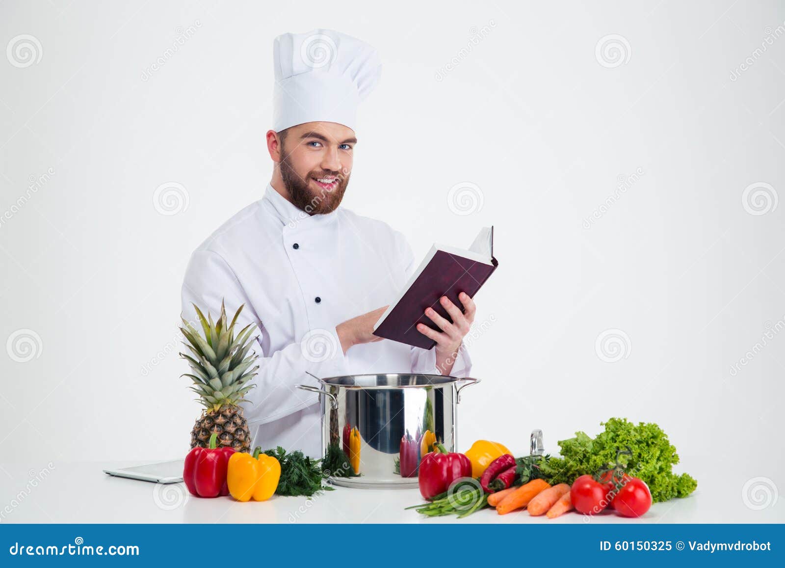 Male Chef Cook Holding Recipe Book and Preparing Food Stock Image