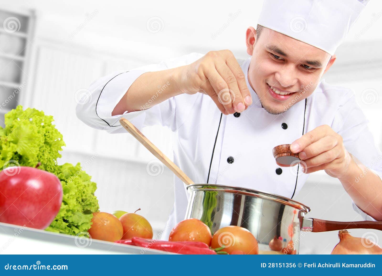 male-chef-cooking-28151356.jpg