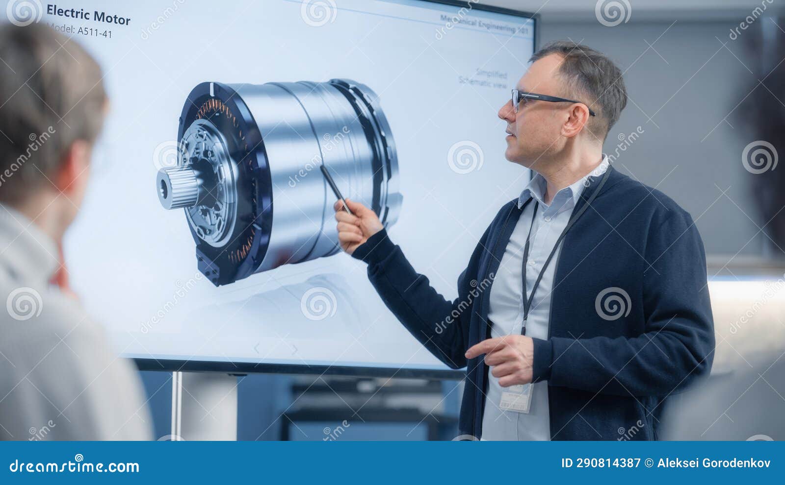 Male Chief Engineer Talks To Young Specialists about Components of the