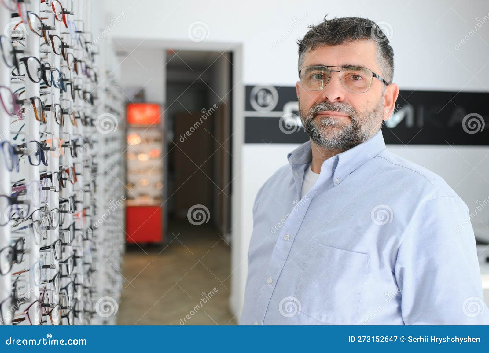 Male Customer Choosing Glasses in Optics Store Stock Image Image of