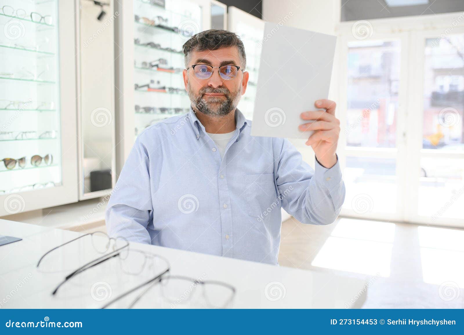 Male Customer Choosing Glasses in Optics Store Stock Image Image of