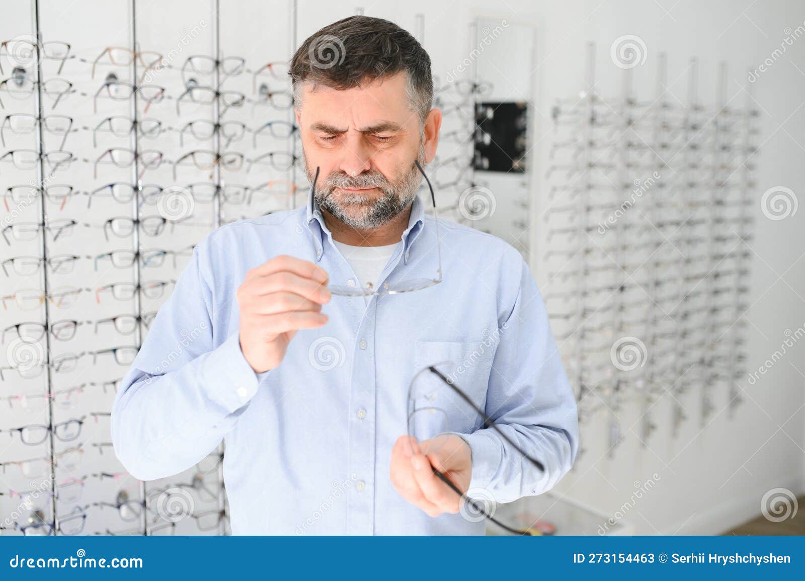 Male Customer Choosing Glasses in Optics Store Stock Image Image of