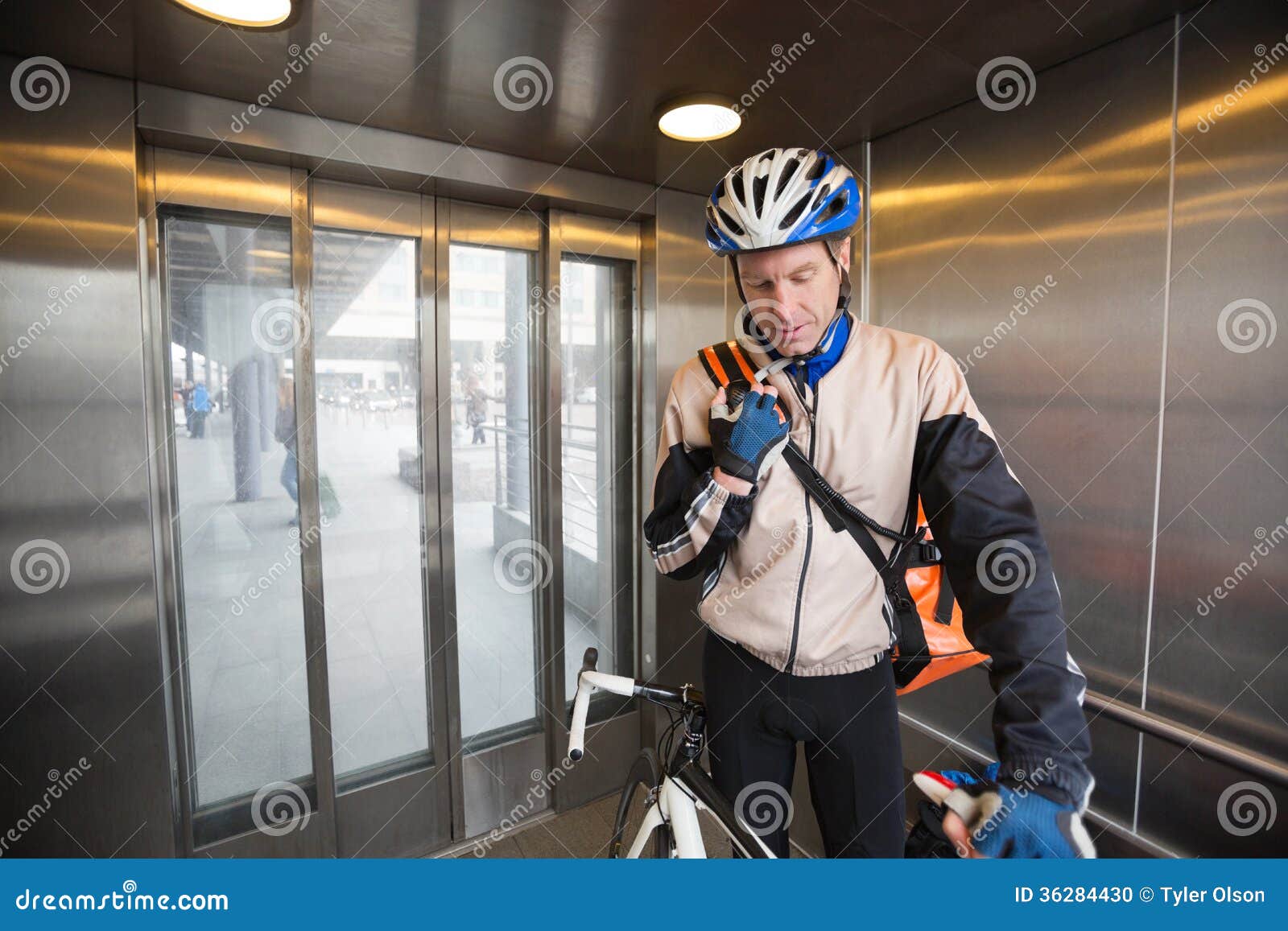 Male Cyclist with Courier Bag in an Elevator Stock Photo Image of